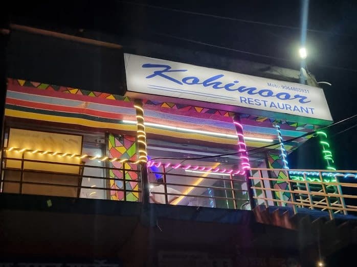 Kohinoor Restaurant in Udhwa lit with colourful lights at night